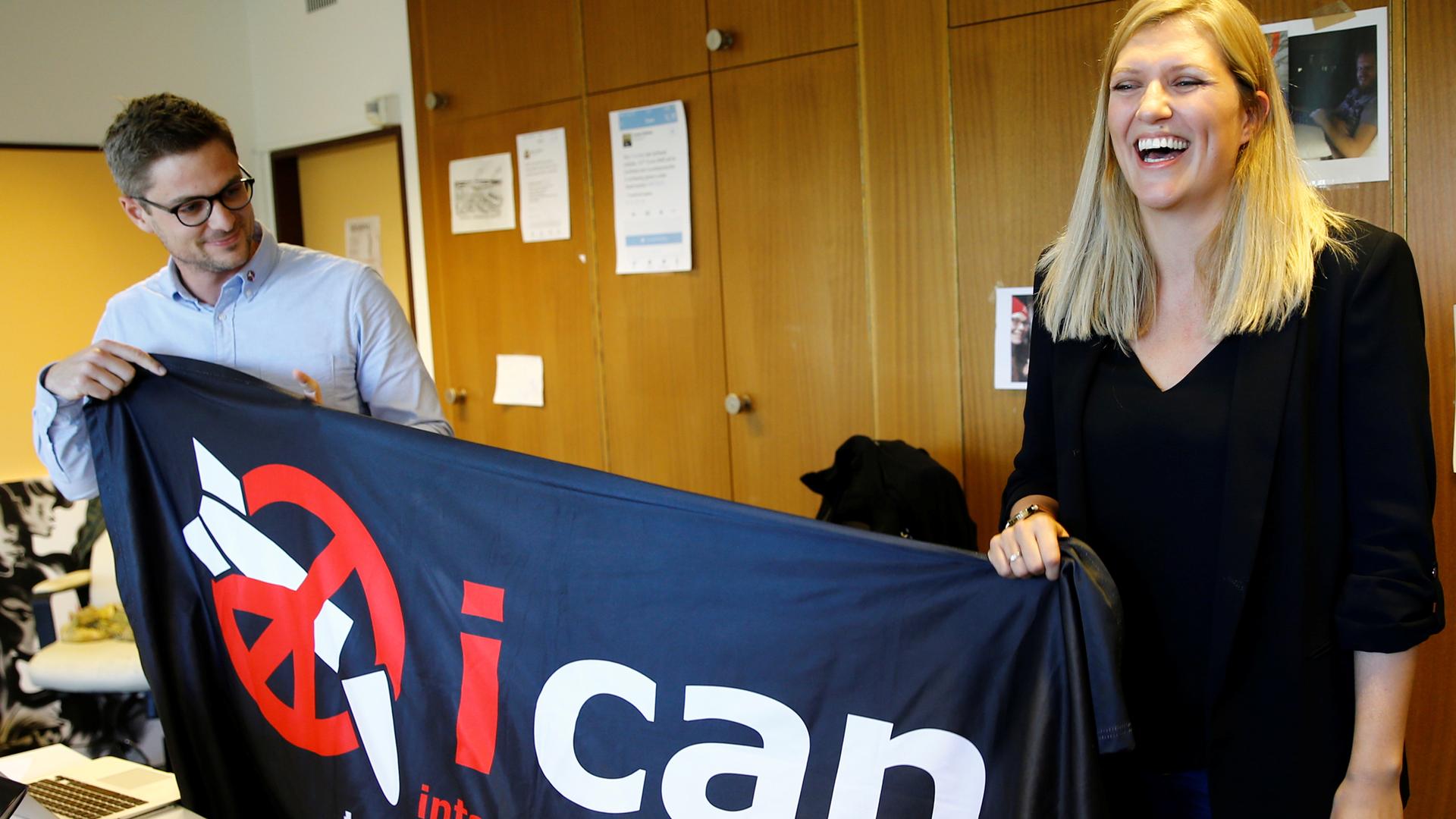 Beatrice Fihn (right), executive director of the International Campaign to Abolish Nuclear Weapons (ICAN) and Daniel Hogsta, coordinator, celebrate after winning the Nobel Peace Prize.