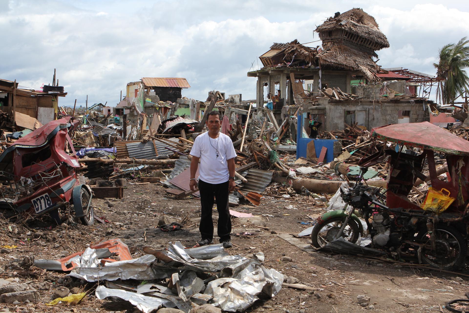 Rene Celis stands in the ruins of Barangay Pampango, a seaside neighborhood in Tacloban that was destroyed by Typhoon Haiyan. Celis was the neighborhood leader—or “captain.”