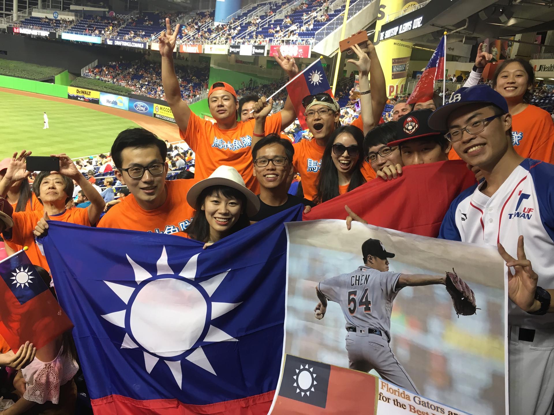 Henry Chen, on the far right holding the Chen sign, drove nearly 340 miles from Gainesville, Fla., to Miami to participate in Taiwanese Heritage Night at Marlins Park with some of his fellow students from Taiwan.