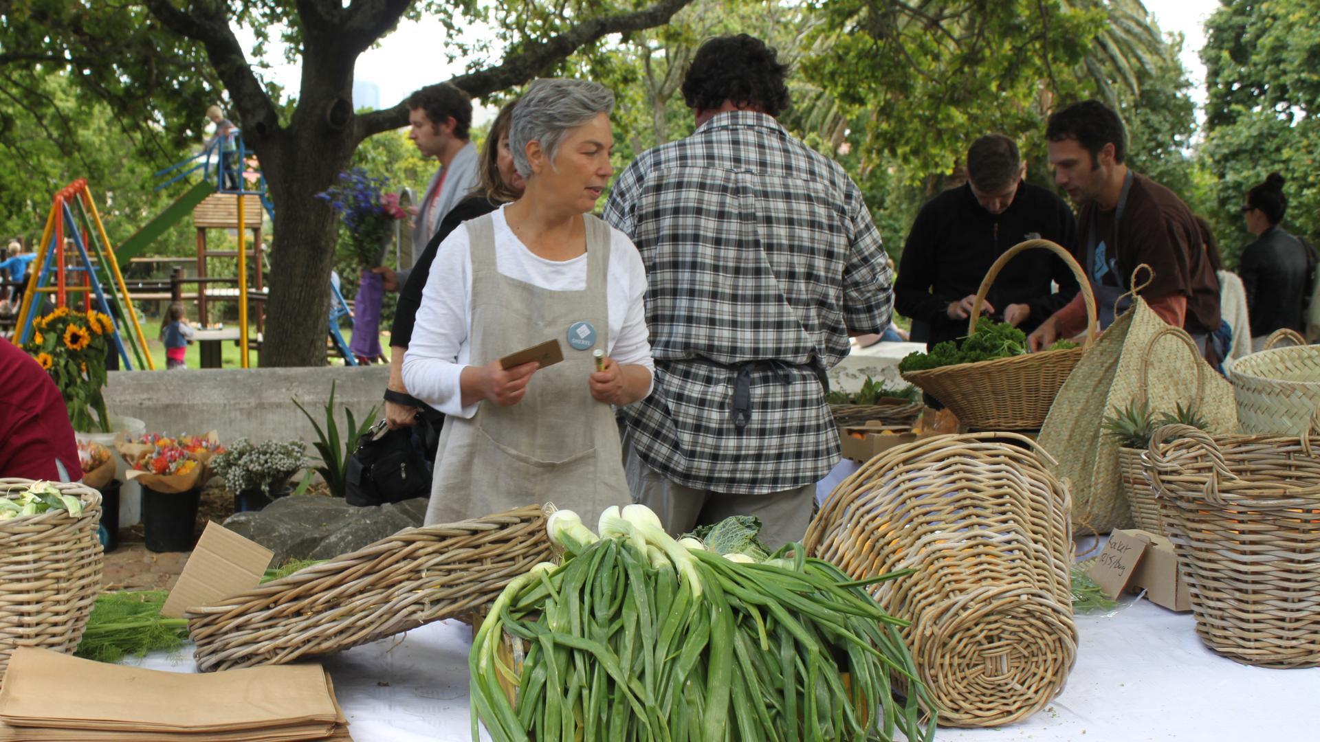Sheryl Ozinsky, one of the founders of the Oranjezicht City Farm in Cape Town, selling produce at the Saturday market.