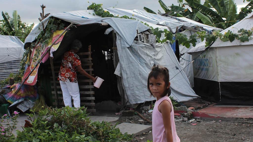 One year after Typhoon Haiyan, about 5,000 people still live in evacuation centers or tents like this one in Sandy Beach, near Tacloban.