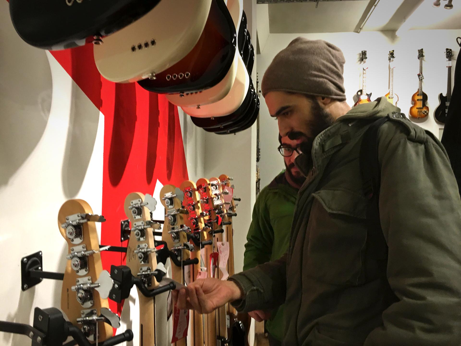 Anas Maghrebi at a music store in central Berlin. He and his Syrian band Khebez Dawle turned their journey from Turkey to Germany into a series of concerts.