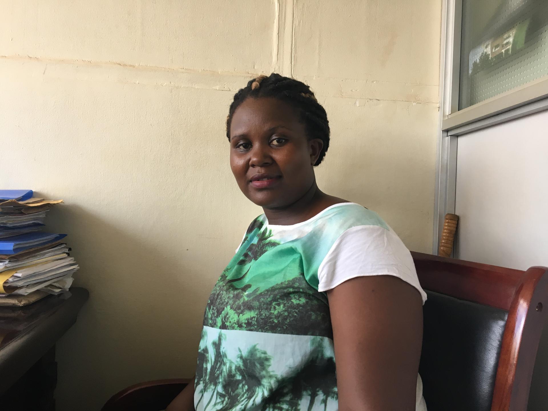 Ugandan teacher Prudence Nandaula sits in an office in Kampala, Uganda.