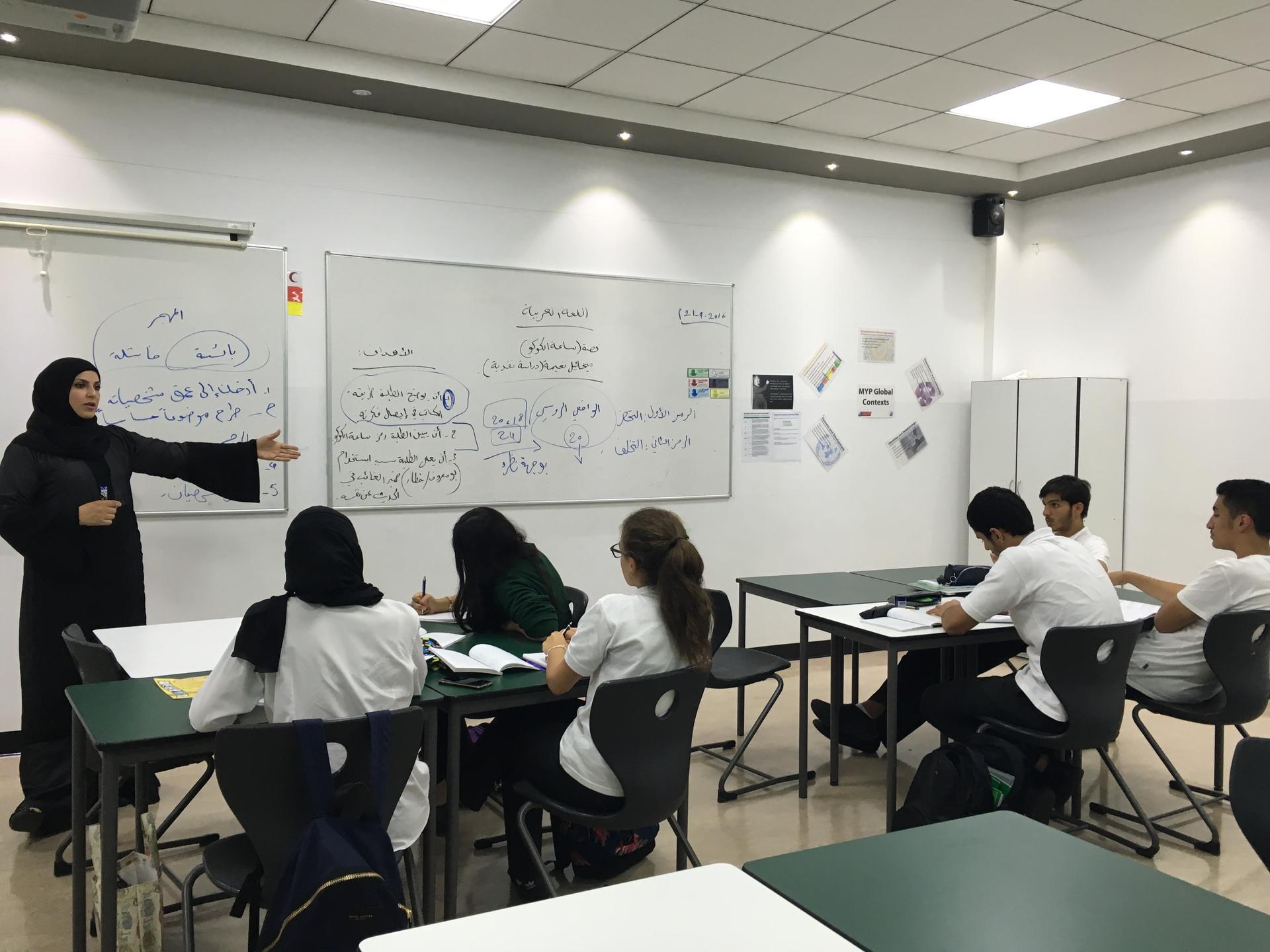 A teacher and her students at an advanced Arabic class at a private school in Dubai.