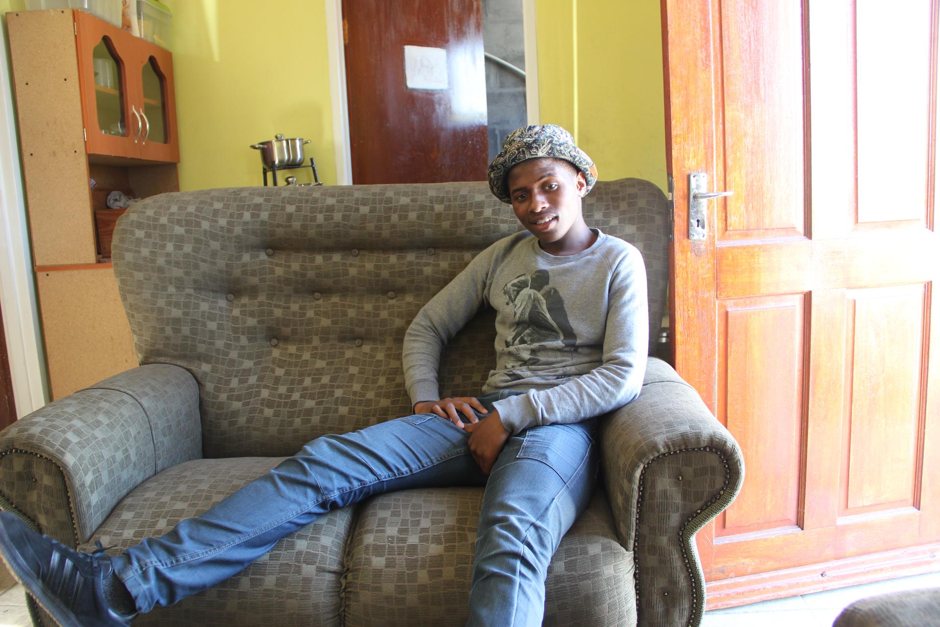 Sive (SEE-vay), a South African high school student, enjoys his new couch.