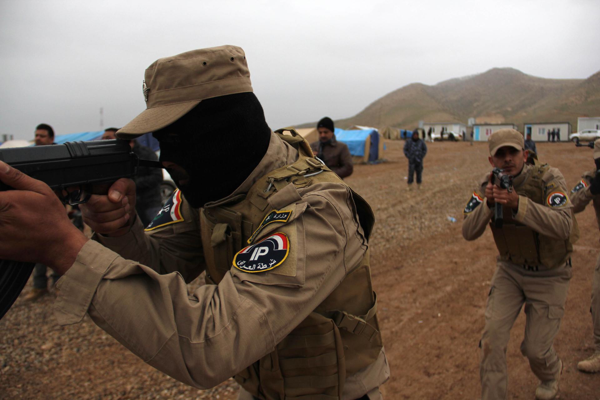 Policemen who fled Mosul train in a camp near Erbil to try to take their city back from ISIS.