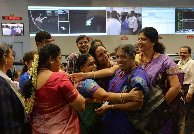 Staff from the Indian Space Research Organization celebrate at the ISRO Telemetry, Tracking and Command Network in Bangalore after their Mars Orbiter spacecraft successfully entered Mars orbit on September 24, 2014.