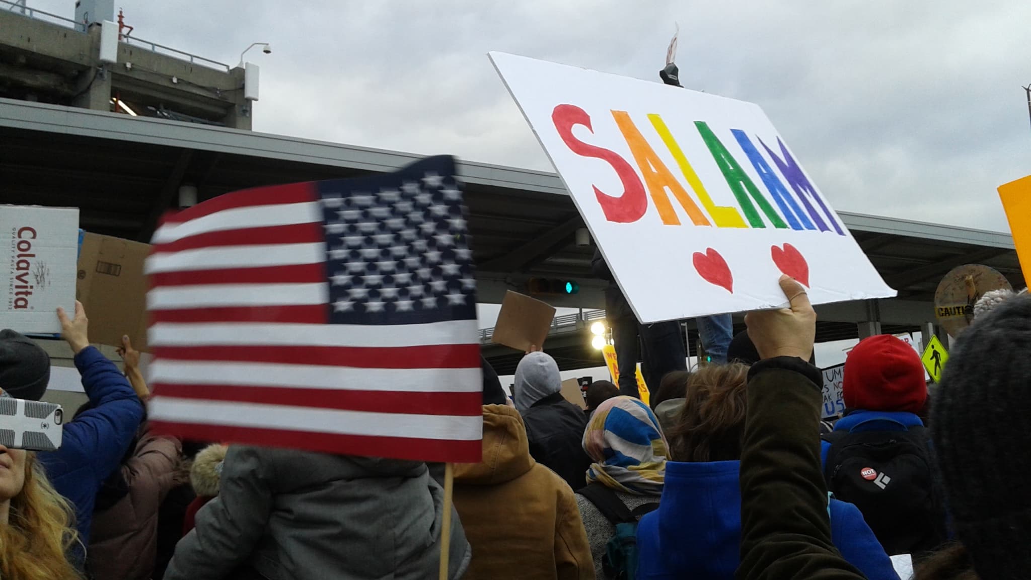 Protesters with signs, one reads Salaam