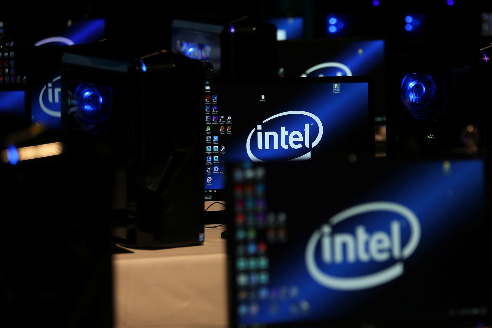 The Intel logo is displayed on computer screens.