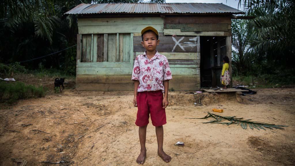 Four years after a forced eviction from ancestral land, the father of 9 year old Revan Pragustiawan says his son is traumatized and afraid to meet people.