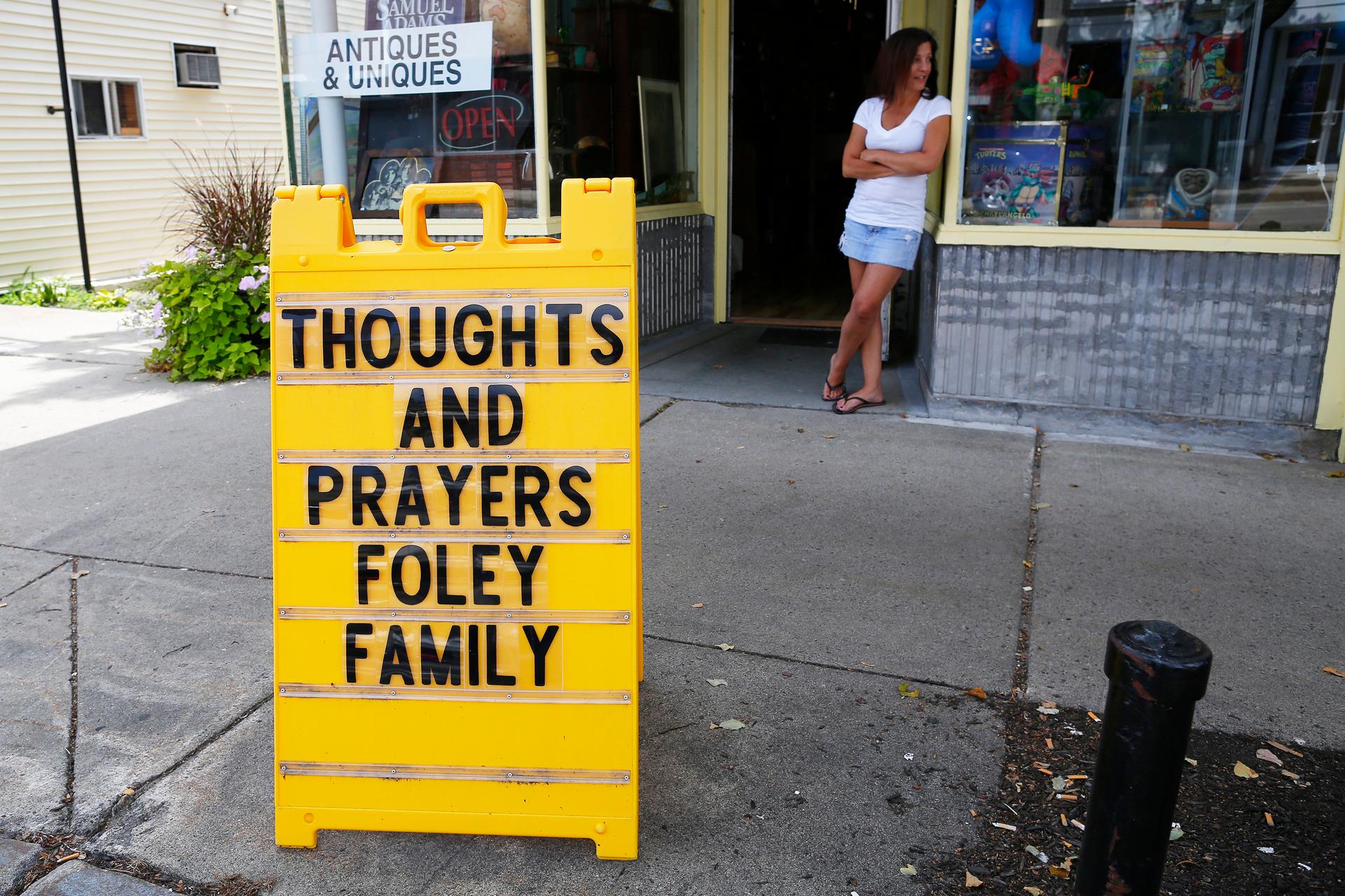 A sign outside a shop remembers James Foley in his hometown of Rochester, New Hampshire. Islamic State militants killed the journalist in a brutal videotaped beheading in revenge for US air strikes in Iraq.