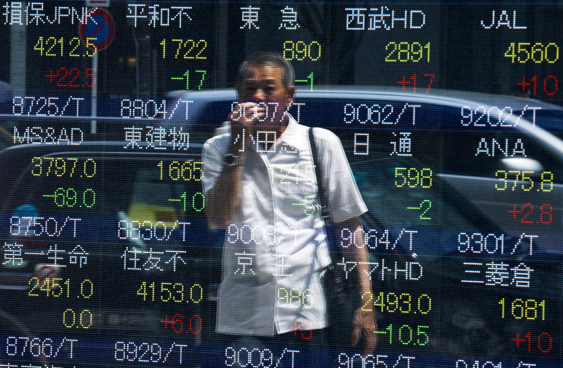 Japan's Nikkei share average dropped Tuesday to a more than two-week low.