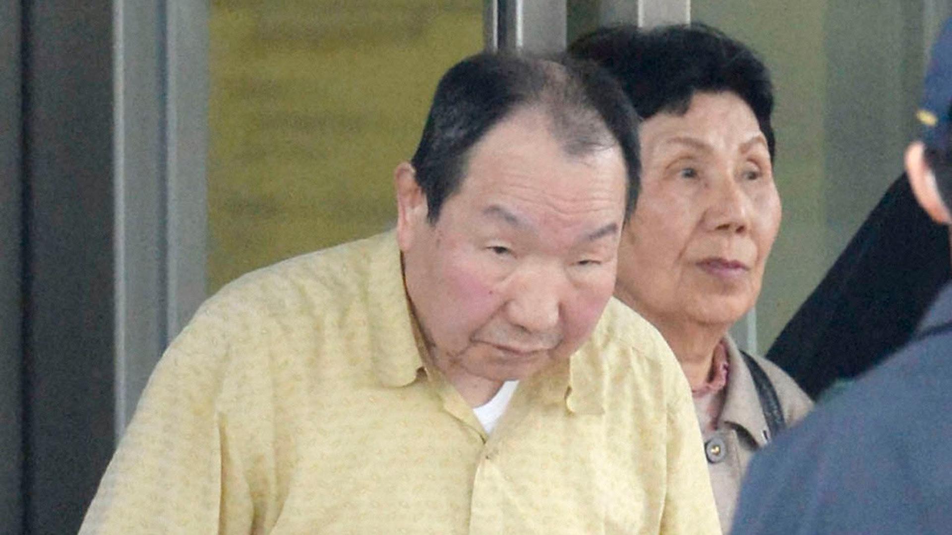 Death row inmate Iwao Hakamada (L), flanked by his sister Hideko, is released from Tokyo Detention House in Tokyo, in this photo taken by Kyodo March 27, 2014. 