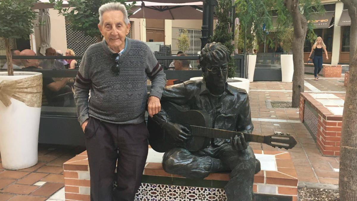 Juan Carrion poses with a statue of John Lennon in Almeria, Spain. 