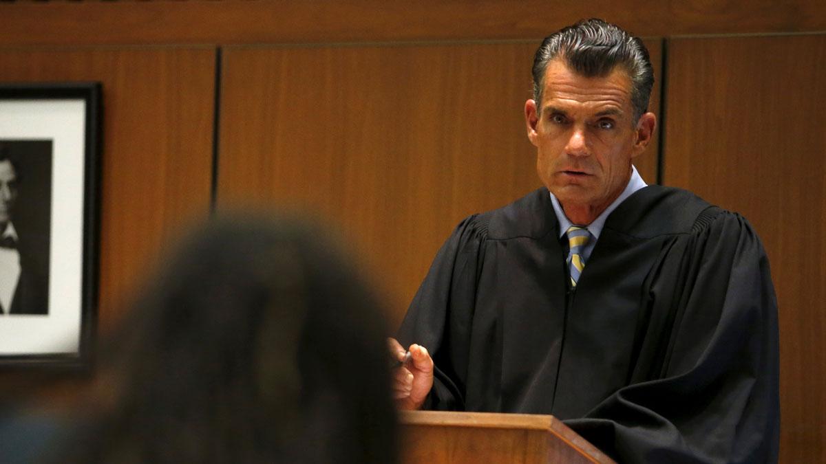 Los Angeles Superior Court Judge Craig Mitchell talks to a defendant.