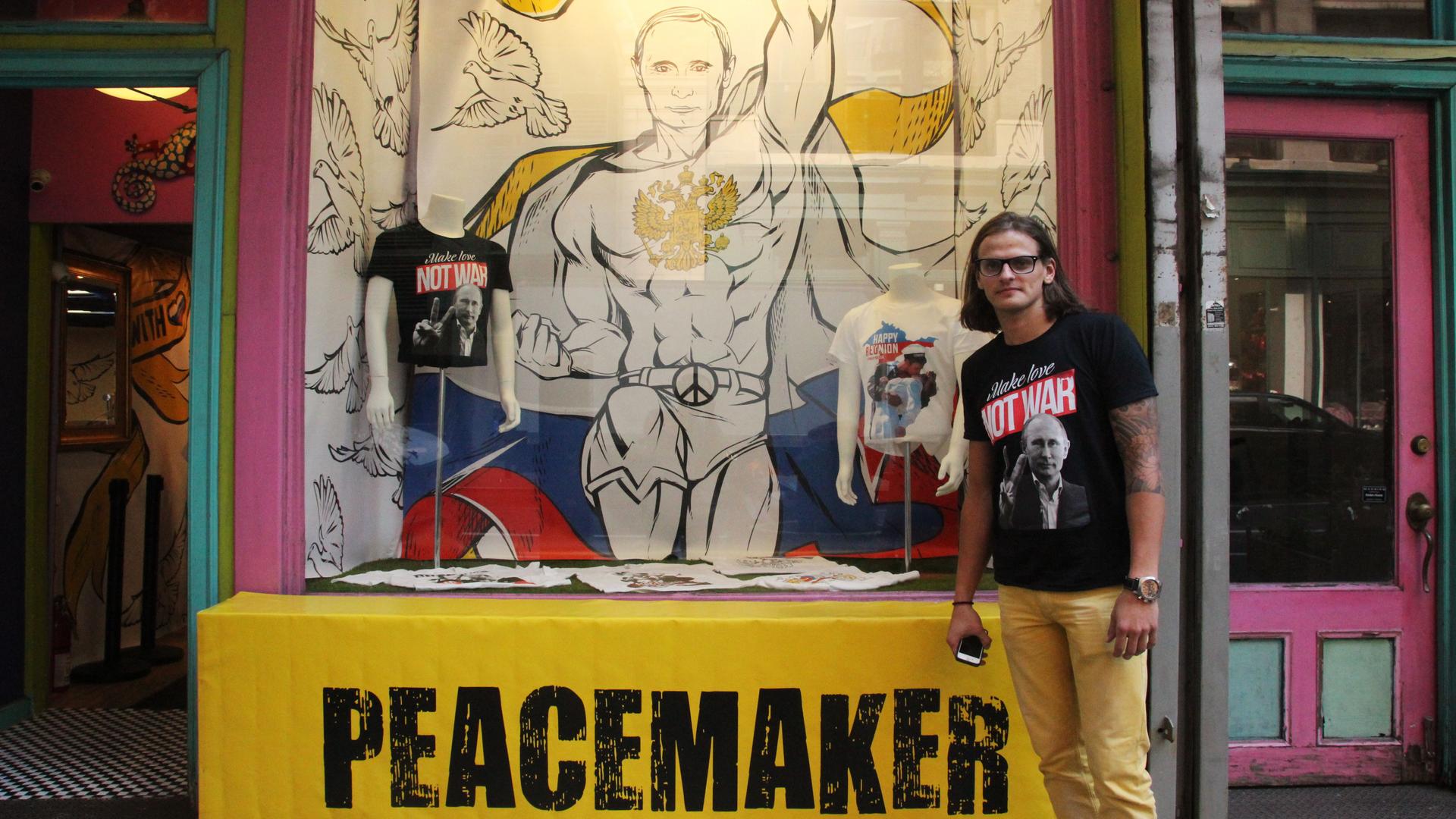 Julius Kacinskis outside of “Peacemaker,” the pop-up shop on East 20th Street in Manhattan where he sells Vladimir Putin t-shirts that he designed. “People portray Putin as a mean guy,” Kacinskis says, “so we gotta educate people."