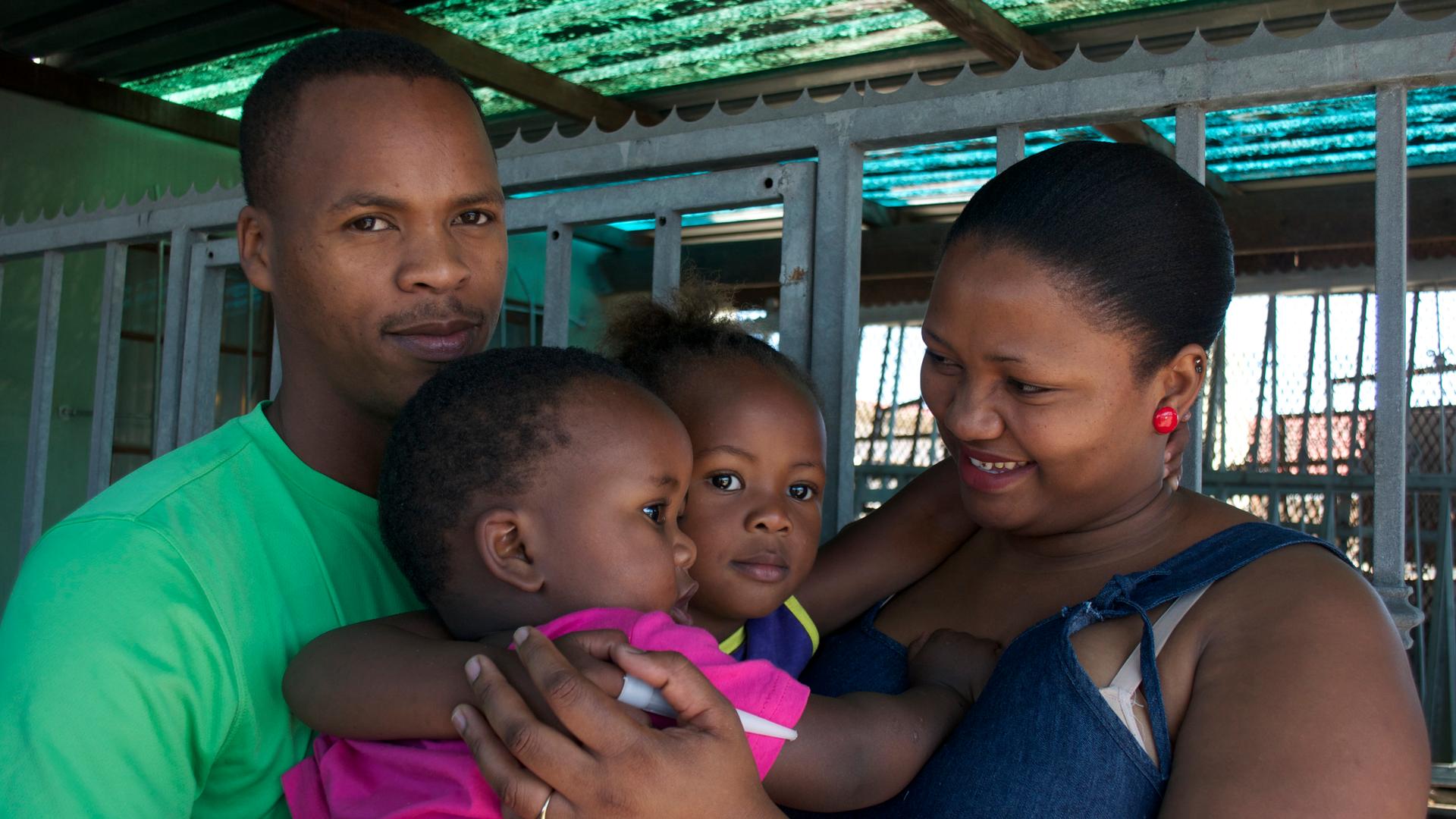 The Mraqisa family (L to R): father Lindela, son Bukho, daughter Ongeziwe and mother Nosicelo outside their home in Gugulethu Township.