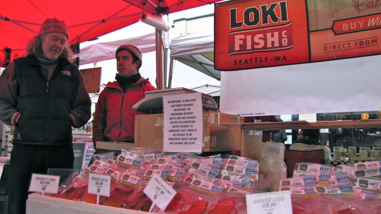 Pete Knutson and his son Dylan sell local Pacific salmon at outdoor markets around the Seattle area. The sign on their stall at a recent market in Seattle's Ballard neighborhood reads, “In response to multiple customer inquiries regarding the Fukushima i
