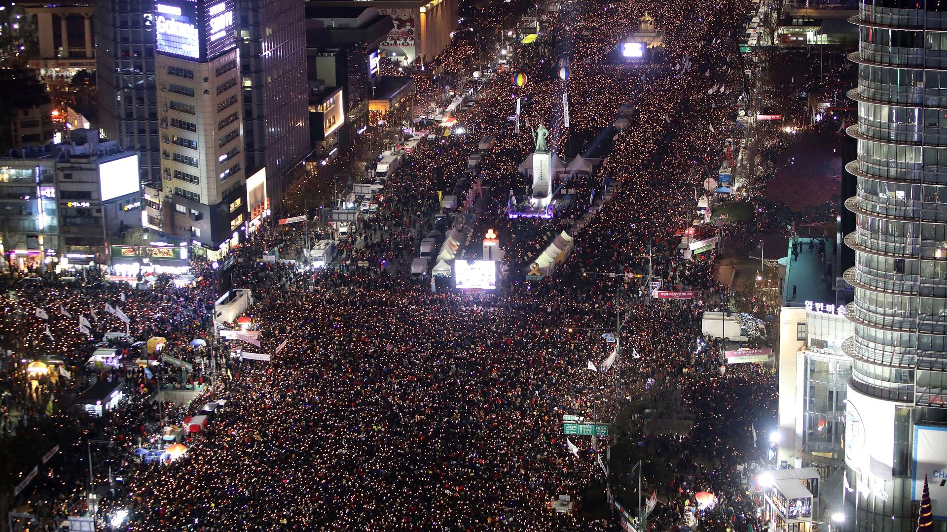Protesters gather and occupy major streets in the city center for a rally against South Korean President Park Geun-hye in Seoul.