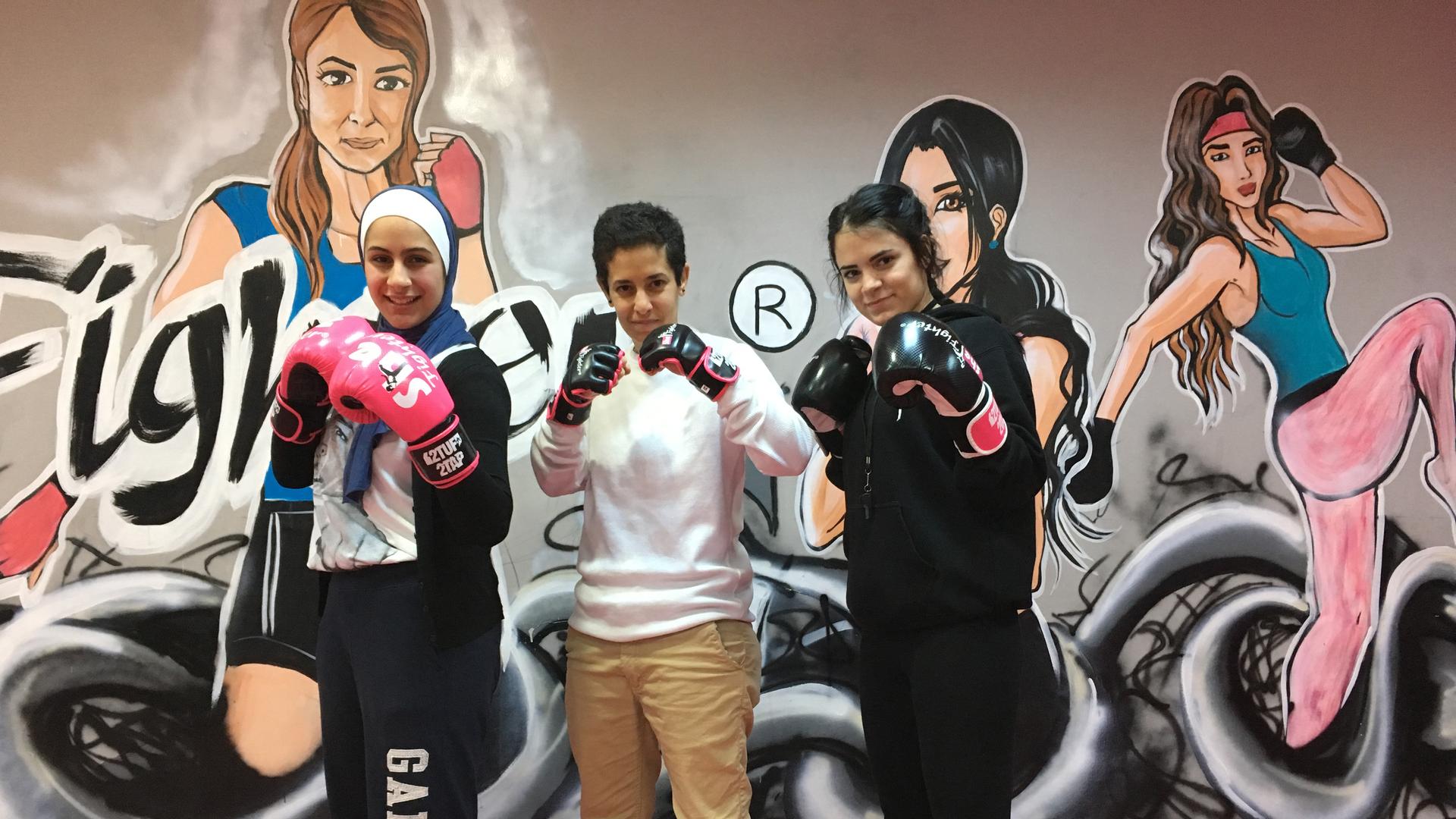 Lina Khalifeh (center), Batoul Jaikat (right) and one of the students at the SheFighter studio in Amman, Jordan.