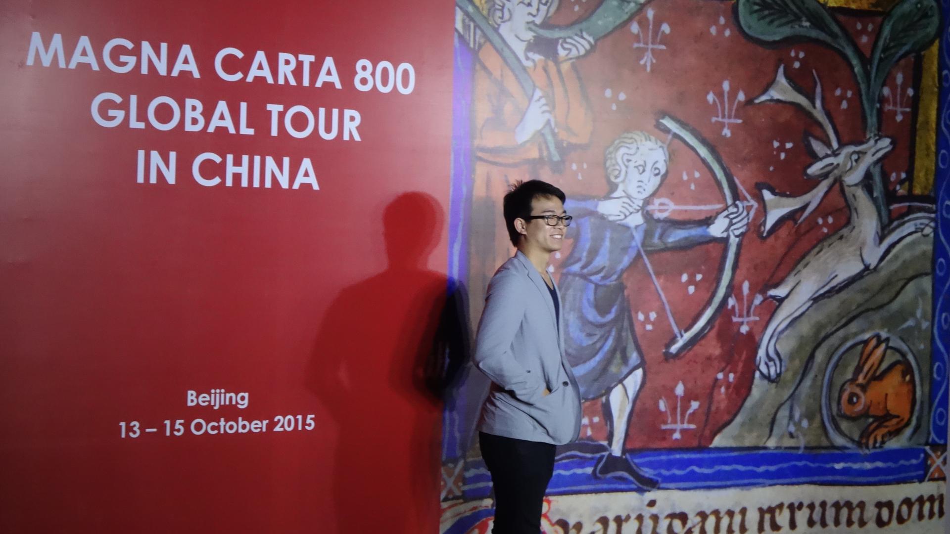 Chinese visitor poses to mark Magna Carta's first visit to China