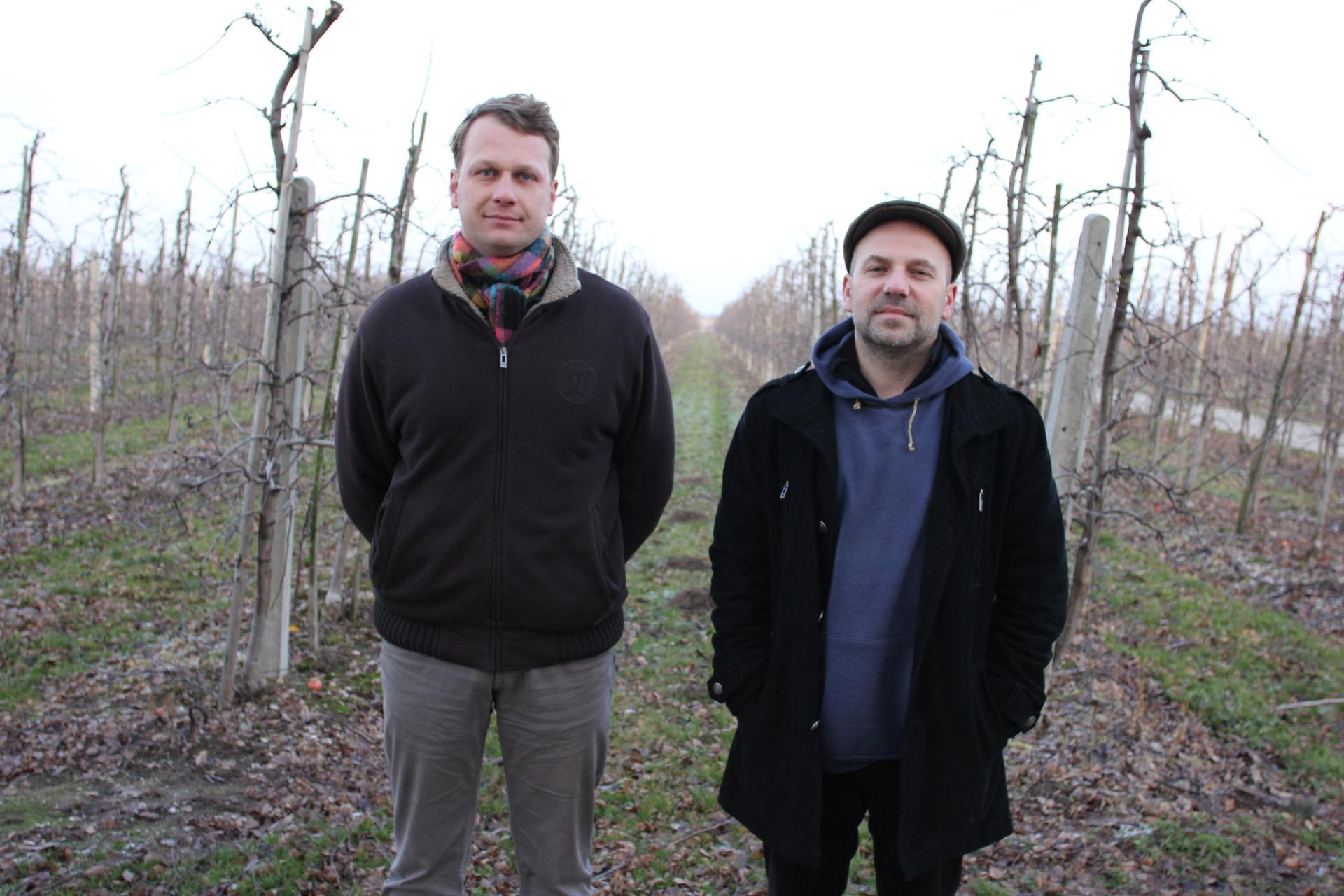 Meet two of Poland's newest commercial cider producers -- Marcin Hermanowicz (left) and Tomek Porowski. They're in an apple orchard in Ignacow, Poland. 