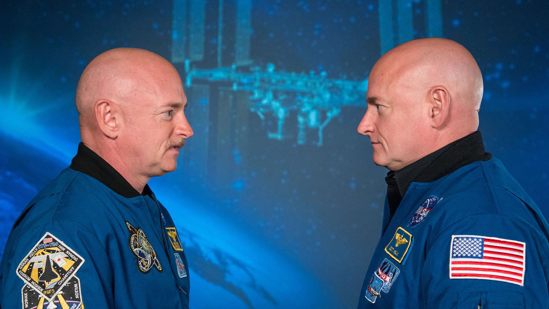 Former astronaut Mark Kelly, left, stands across from his brother, Scott Kelly, the current commander of the International Space Station.