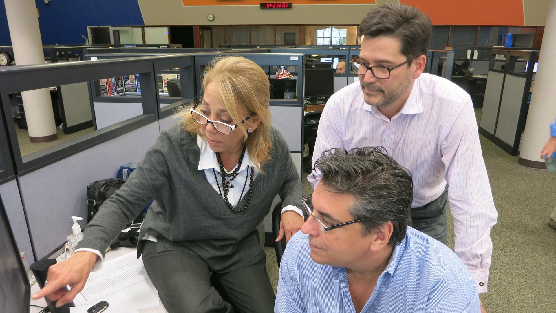 Malule González (left) and her team work on the news rundown in the Radio and TV Martí newsroom in Miami.