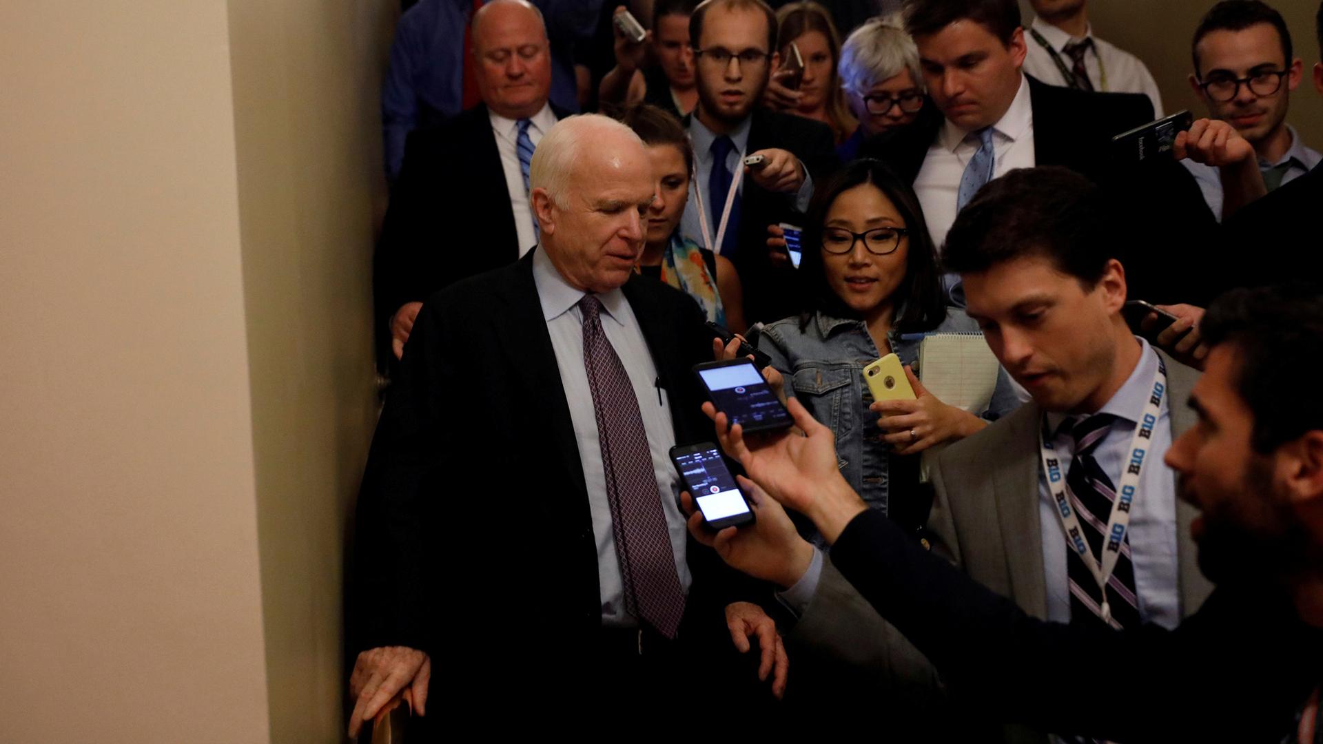 Senator John McCain speaks with reporters after voting against the "skinny repeal" health care bill on Capitol Hill in Washington, July 28, 2017.