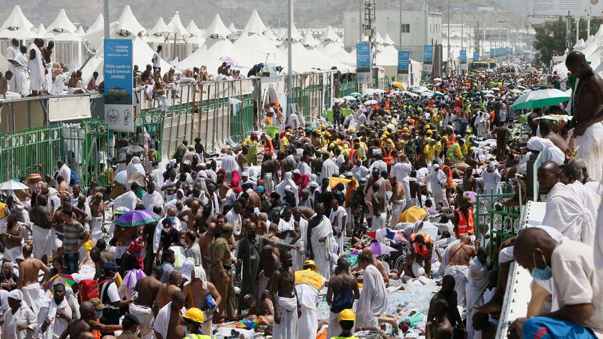 Muslim pilgrims and rescuers gather around people who were crushed by overcrowding in Mina, Saudi Arabia during the annual hajj pilgrimage.