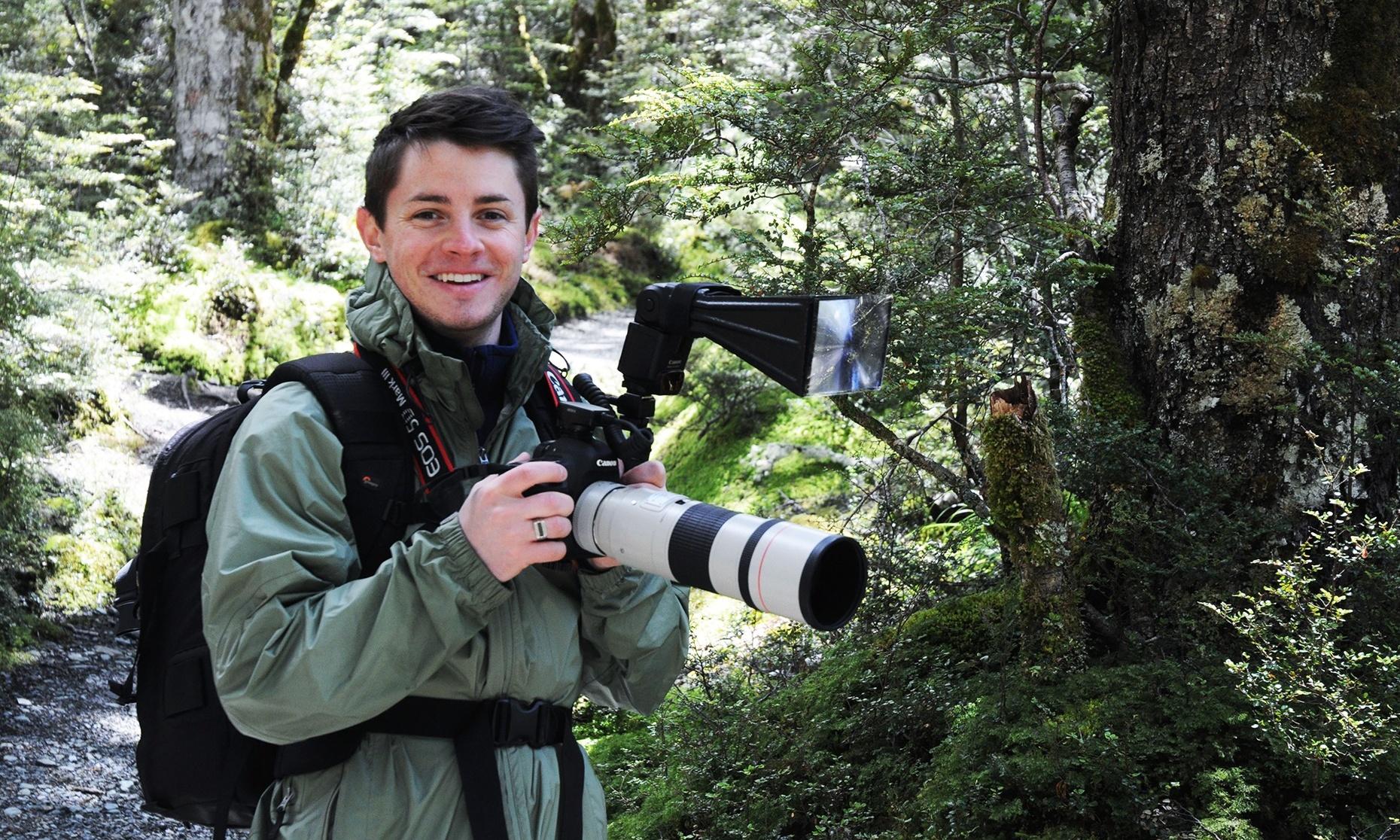 Ben Mirin photographing birds in New Zealand's Fiordland