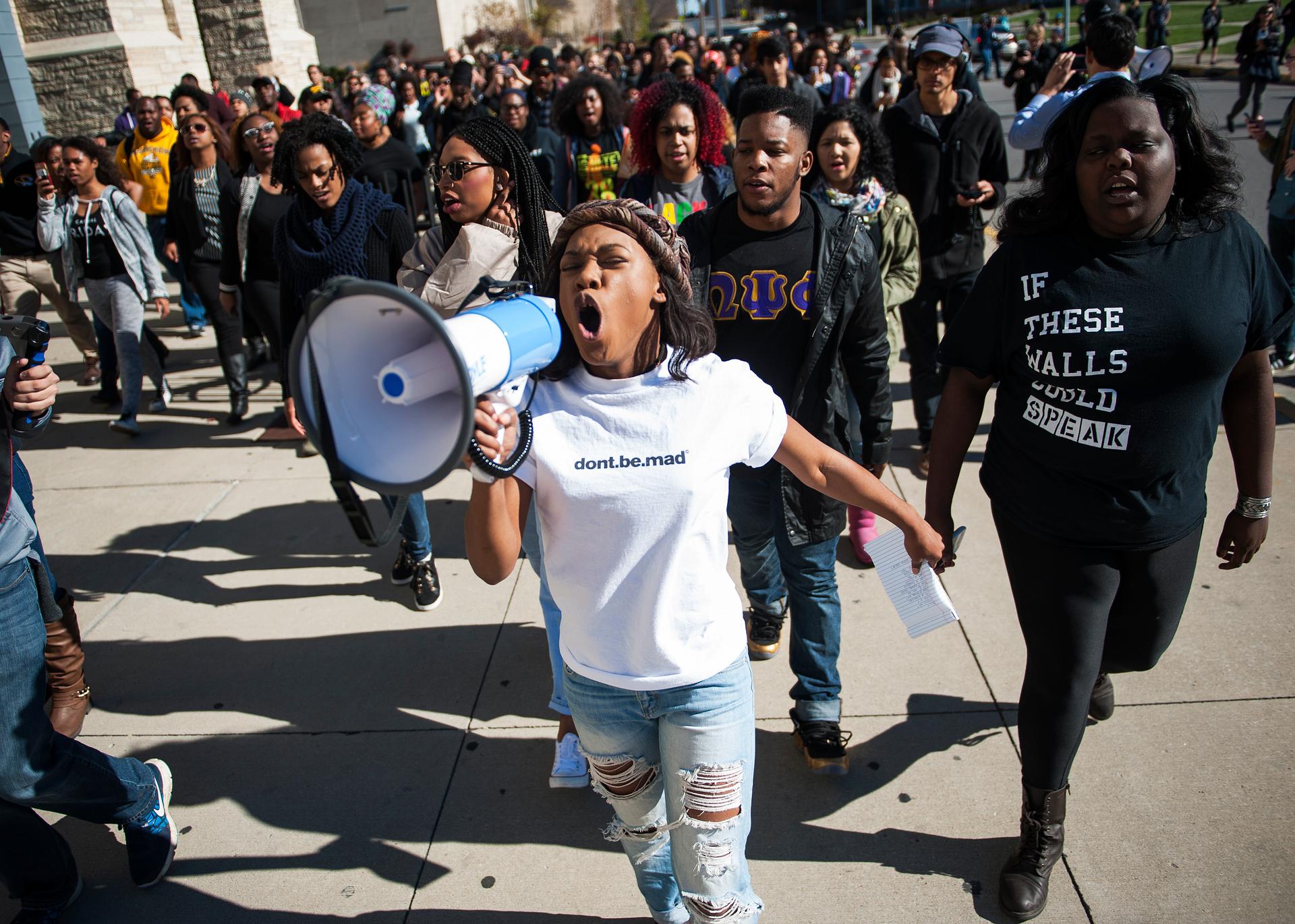 Concerned Student 1950 member Ayanna Poole uses a megaphone while leading a "We Are Not Afraid" march.