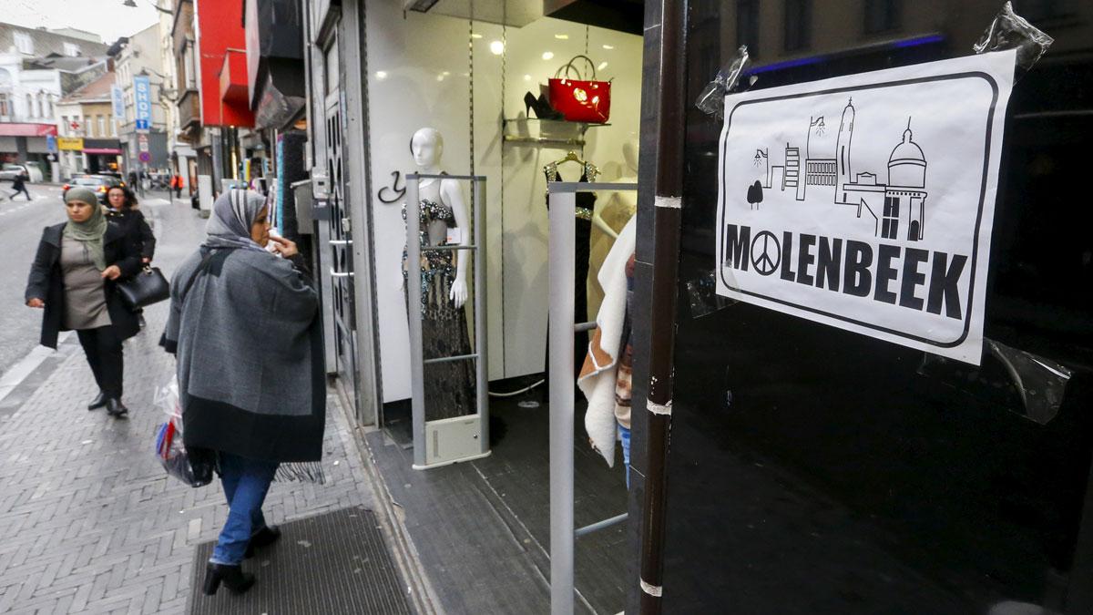 A placard reading Molenbeek with a "peace and love sign" is seen in a shopping street in the suburb of Molenbeek, after security was tightened in Belgium following the attacks in Paris in November.