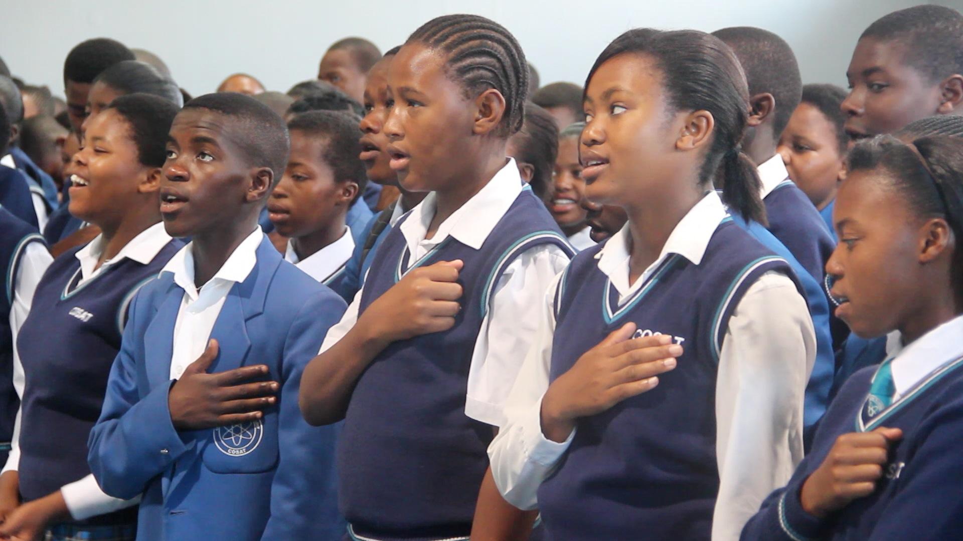 COSAT students sing national anthem.