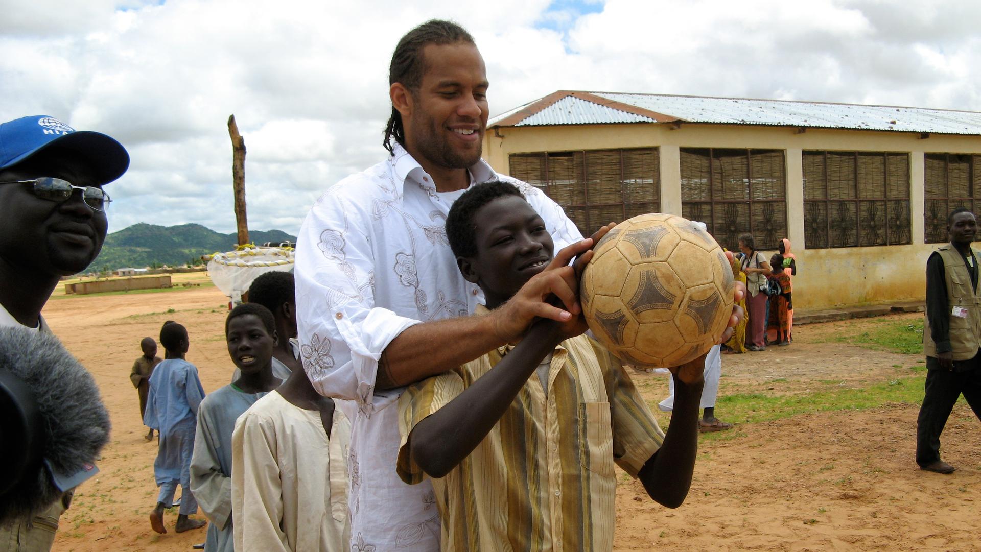 Former NBA player Ira Newble at a refugee camp on the Chad/Sudan border. 
