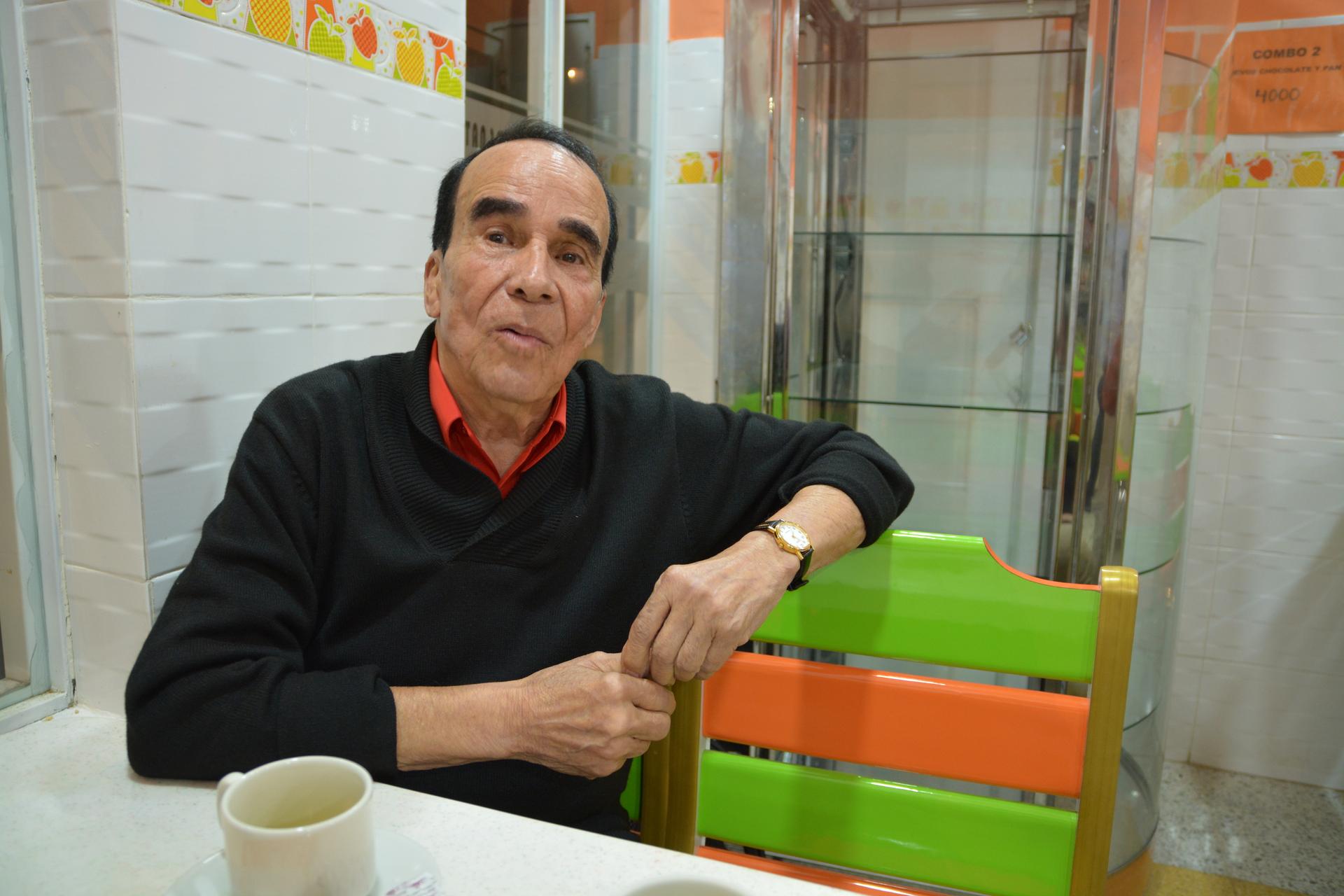 Noel Petro enjoys a cup of coffee in a Bogotá cafe
