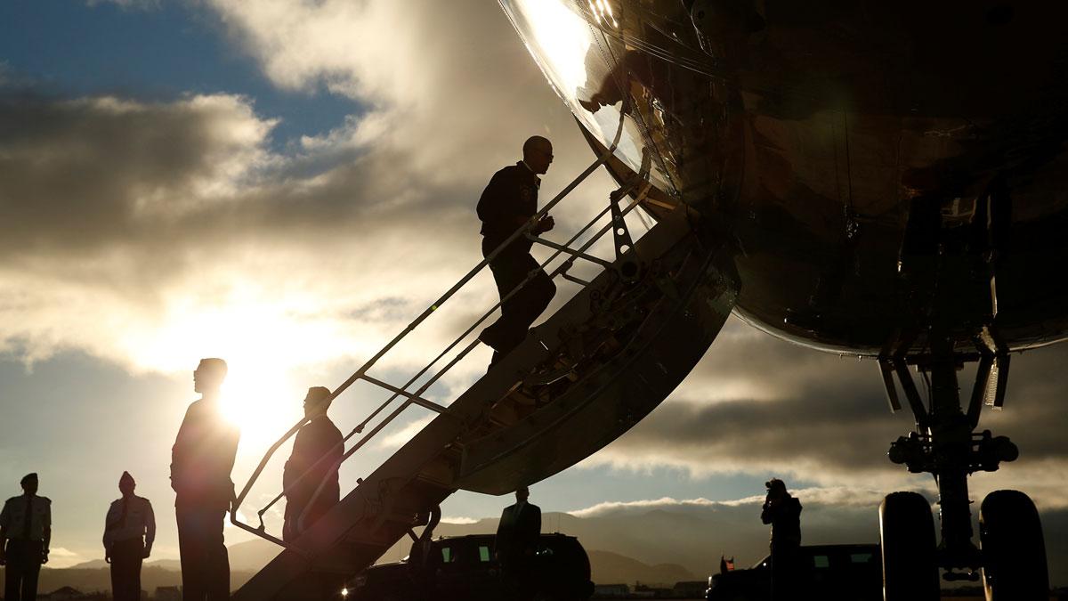 US President Barack Obama boards Air Force One after a refueling stop in Lajes Air Base in the Azores, Portugal, on his way to Peru.