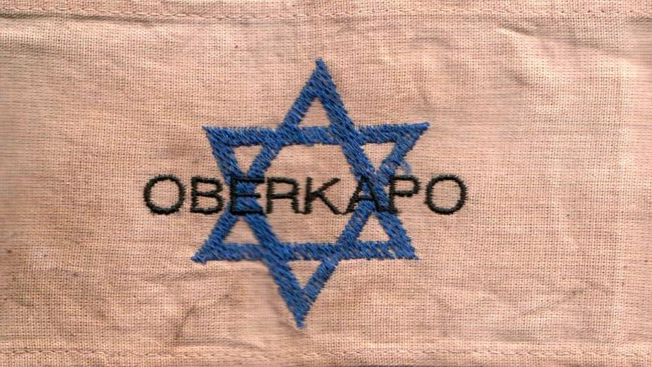 The armband of a chief kapo, or "oberkapo" in a Nazi concentration camp