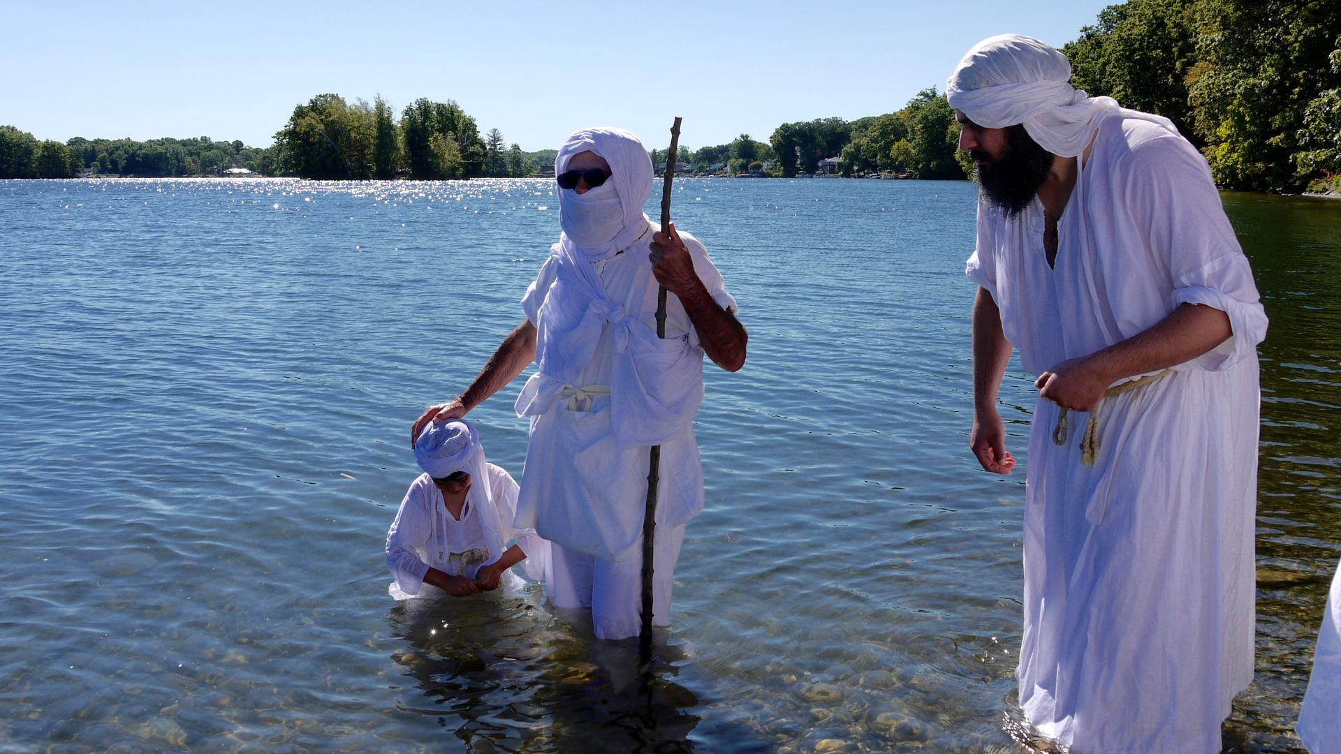 Sheikh Salah (center) is baptizing one of several dozen Mandaeans at Lake Quinsigamond in Worcester, Massachusetts, on Sept. 25, 2016.   