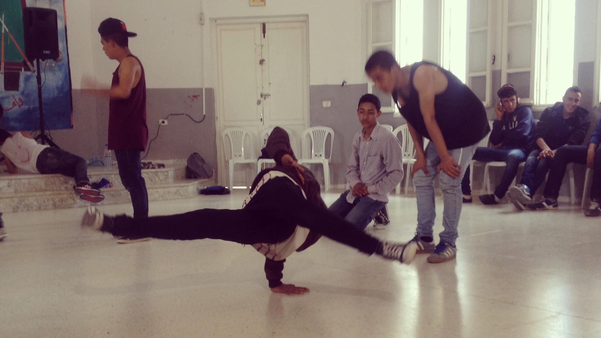 Nidhal Bouallagui's breakdance troupe practices their moves.