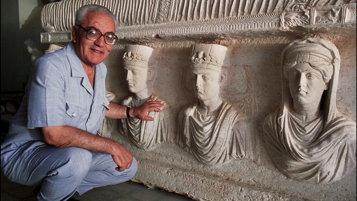Khaled al-Asaad, the director of Antiquities and Museum in Palmyra, in front of a rare sarcophagus in Palmyra.