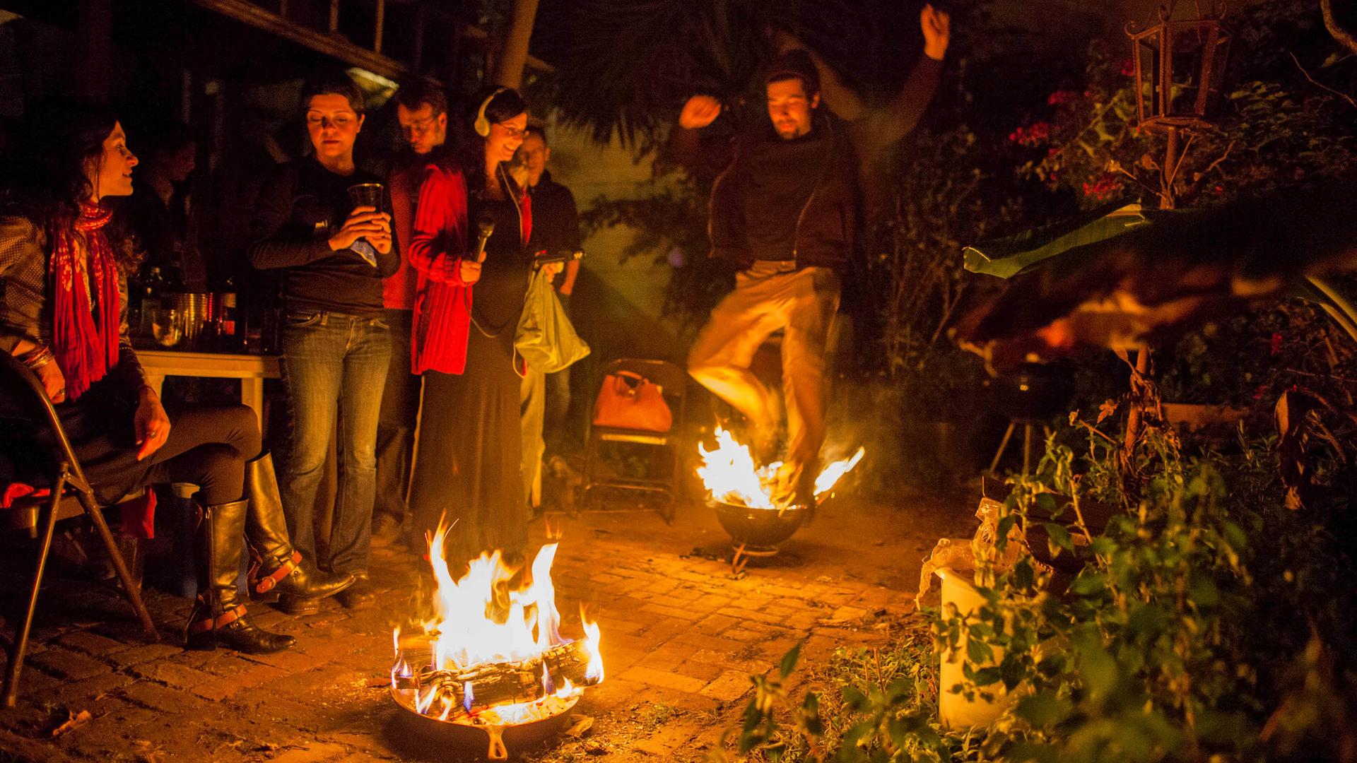 The reporter, Shuka Kalantari, records the sounds of a Persian New Year's celebration at her friend's home. Jumping over a small fire is a symbolic gesture to start a fresh new year.