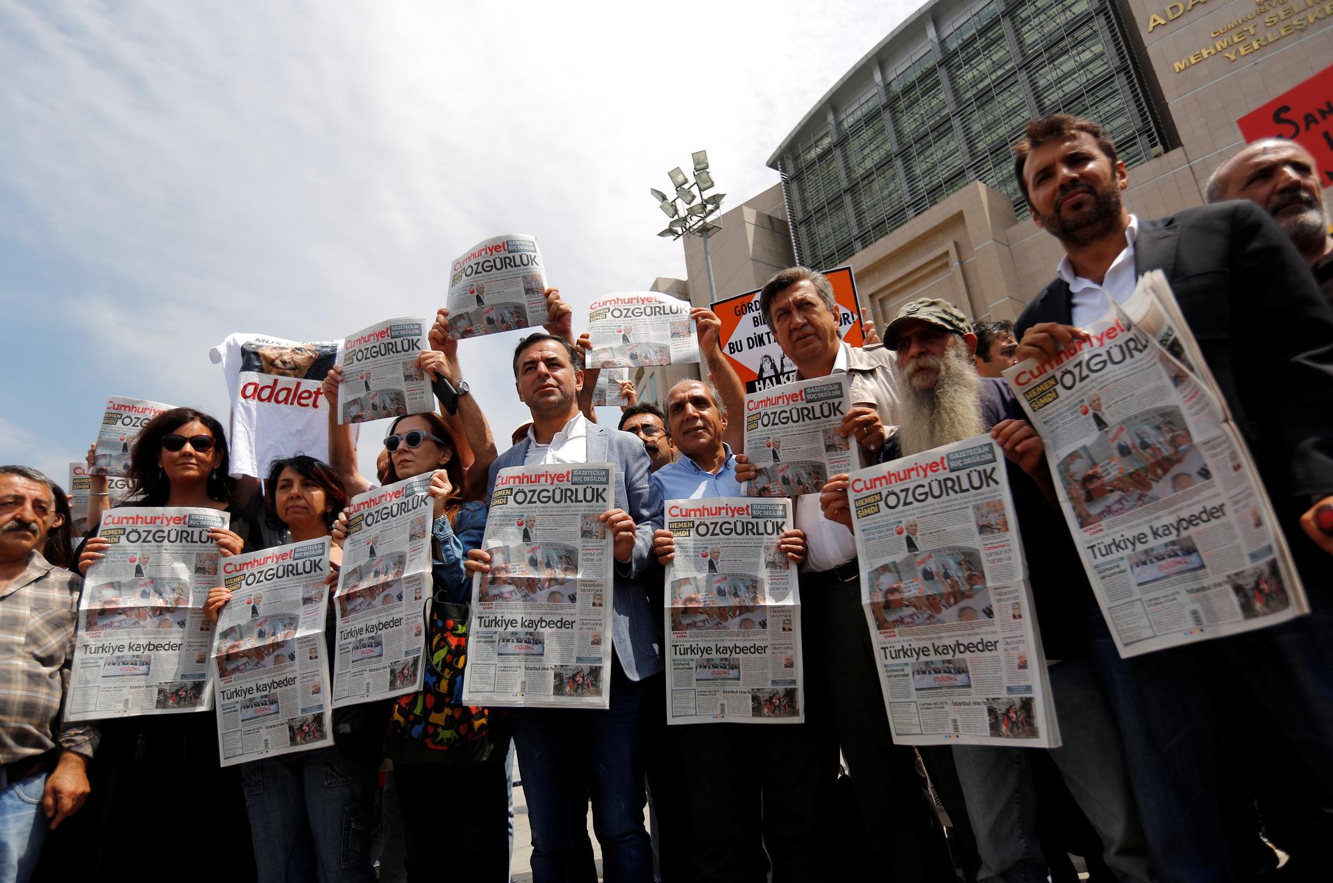 Press freedom activists hold copies of the opposition newspaper Cumhuriyet during a demonstration in solidarity with the jailed members of the newspaper outside a courthouse, in Istanbul, Turkey, July 28, 2017.