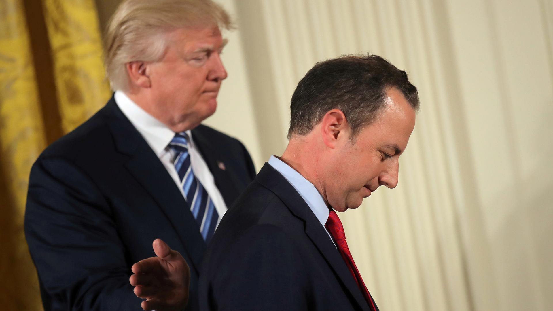 President Donald Trump pats Reince Priebus on the back at the White House in January.