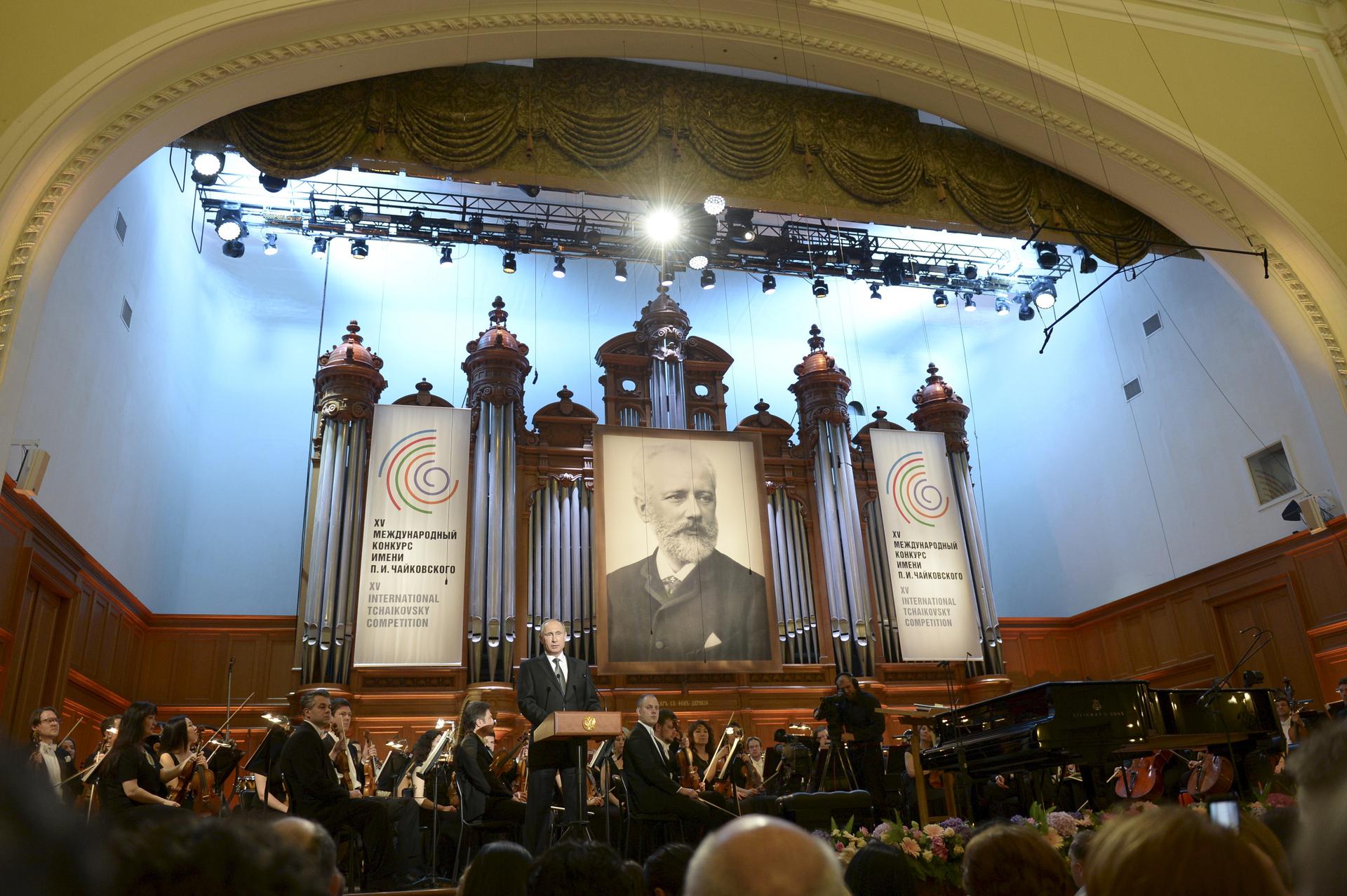 Vladimir Putin is dwarfed by a picture of Russian composer Pyotr Tchaikovsky at the gala concert of the 15th International Tchaikovsky Competition at the Moscow Conservatory on July 2nd. The Russian President addressed the crowd describing the competition