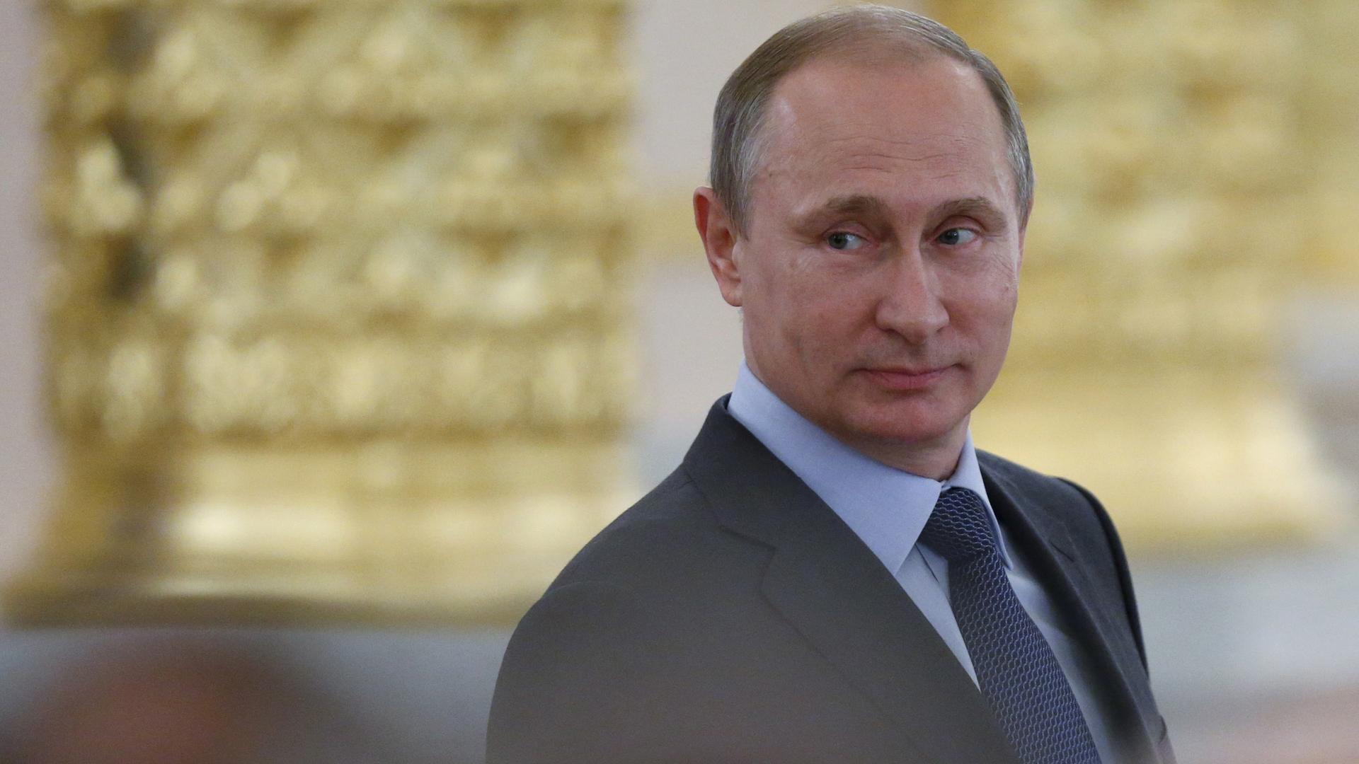Russian President Vladimir Putin attends a session of the Civic Chamber at the Kremlin in Moscow, Russia, June 2015.