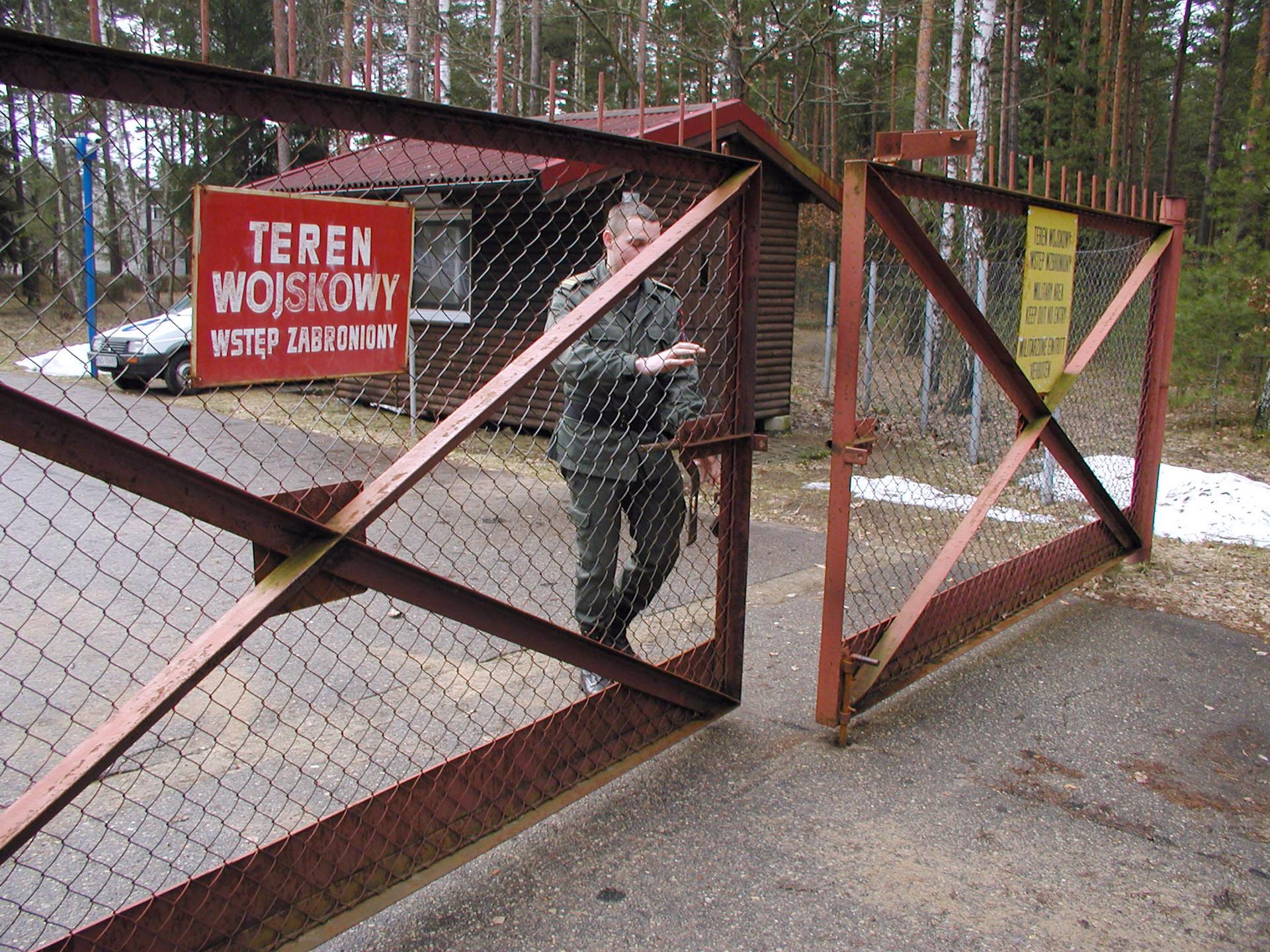 A guard shuts the gate to the airport in Szymany, Poland, in 2005. Polish media said the airport was identified by Human Rights Watch as a potential site of alleged CIA prisons used to interrogate al-Qaeda captives.