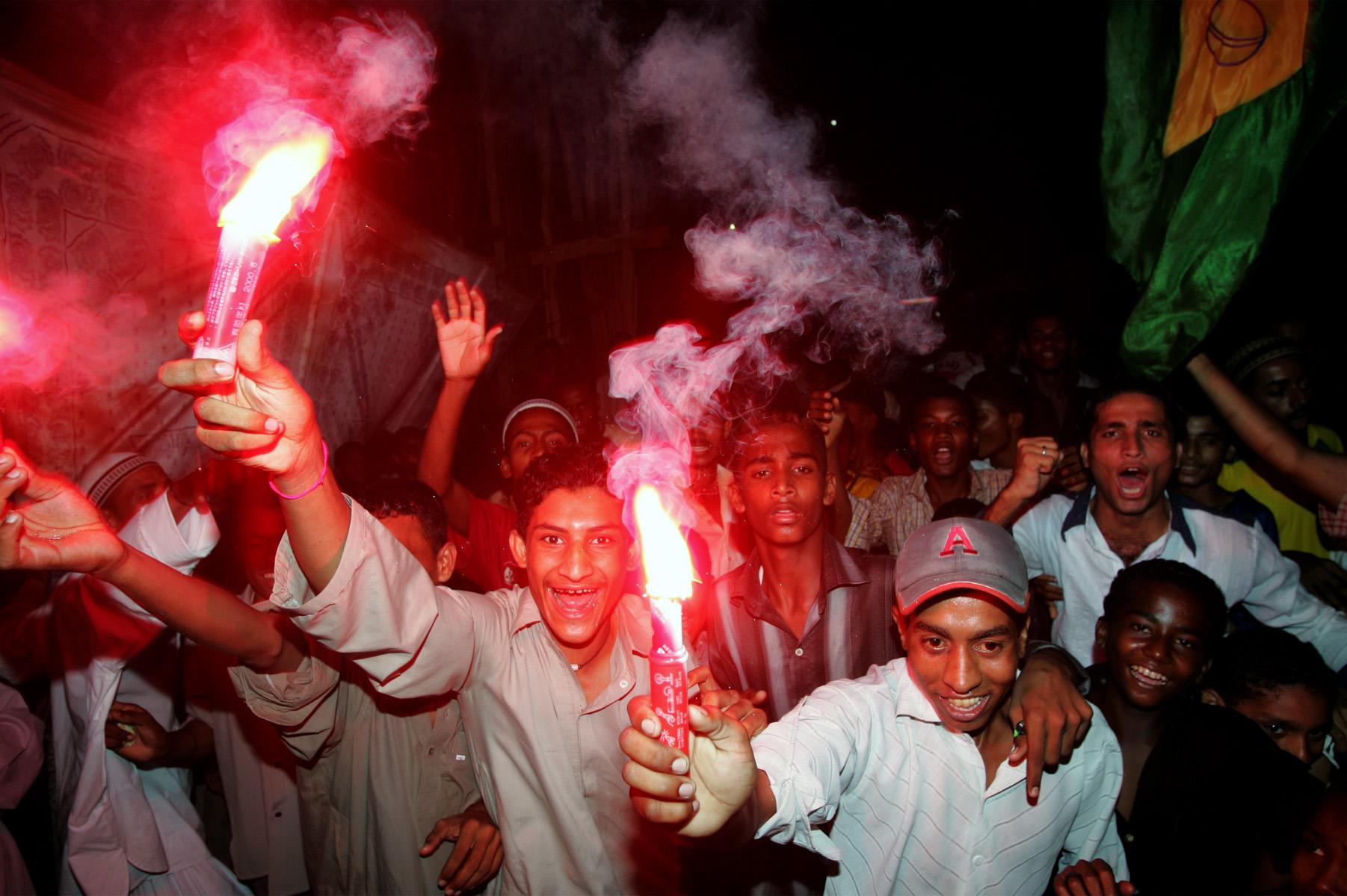 Pakistani soccer fans celebrate a Brazil victory in Lyari, one of the oldest and most densely populated parts of the city, plagued by street crime, drugs, and unemployment.