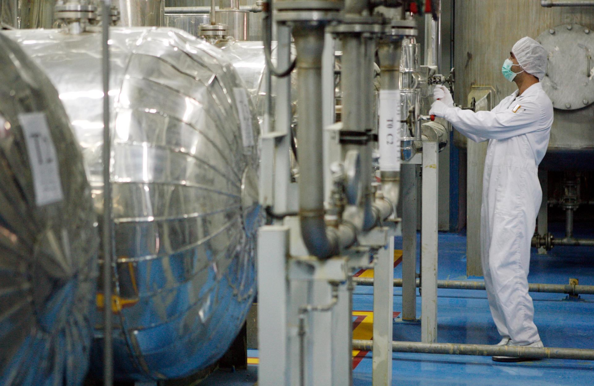 A technician checks valves at the uranium conversian facility in Isfahan, 450 km south of Tehran, February 3, 2007.
