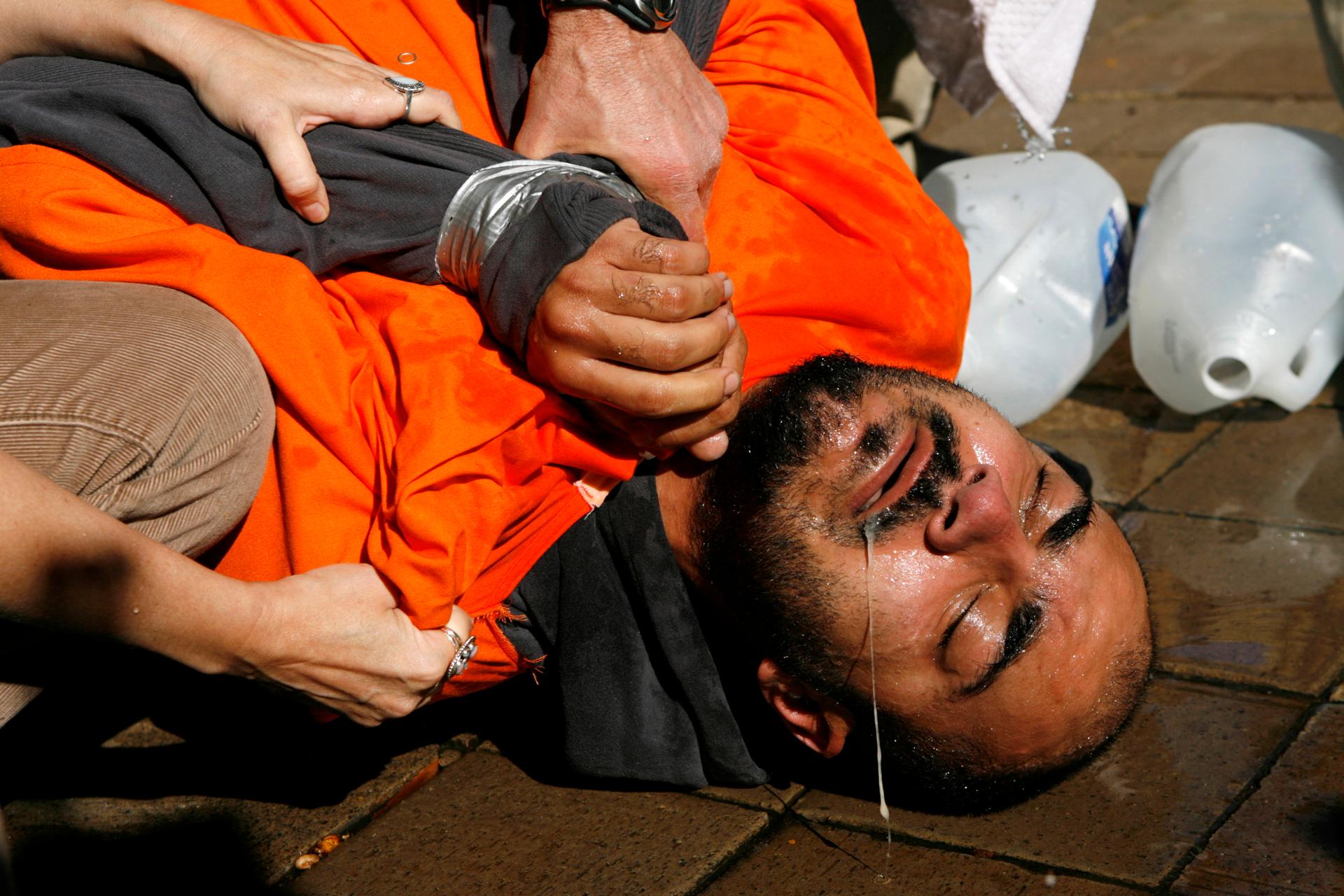 A demonstrator is held down during a simulation of waterboarding outside the Justice Department in 2007.